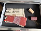 a box that has a ticket and some other items in it