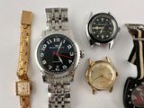 many different types of watches on a white surface