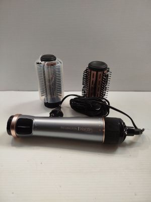 a hair dryer and a blow dryer sitting on a table