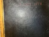 an old picture of a blackboard in a wooden frame on a wall