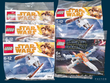 Plusieurs sets Lego Star Wars sont exposés sur un fond bleu
