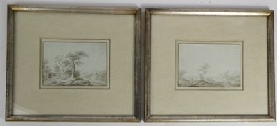two framed drawings of trees and a river in a gold frame