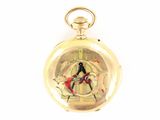 a gold pocket watch with a picture of a man and a woman on it