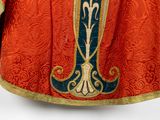 an image of a priest ' s robe with a cross on it