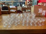 many wine glasses on the table ready to be filled