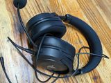 a pair of headphones sitting on a wooden floor