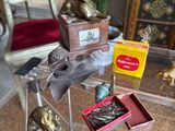 a glass table with a lot of figurines on it