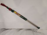 a close up of a baseball bat laying on top of a white sheet