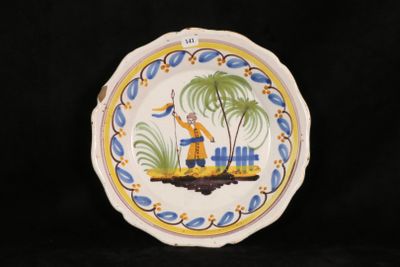 a plate with a picture of a man on a boat
