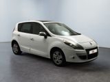 a picture of a small white car parked in a room