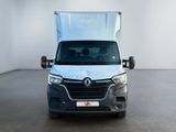 the front view of a silver van parked in a white room
