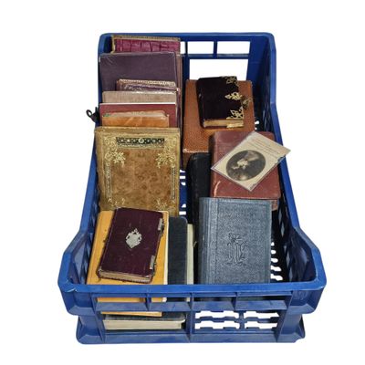 many books in a blue crate on a white background