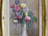 a painting of flowers in a vase hanging on a wall