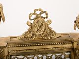 two gold vases sitting on top of a table