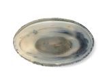 a picture of a white and black plate on a white surface