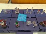 many glass figurines on display on a table