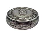 a small silver box with a crown on top of it