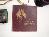 a book with a picture of a horse on it next to a hat and a camera