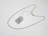 a close up of a necklace with a price tag on it