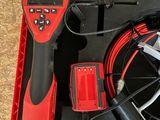 a red box with a black and red tool in it