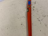 a red tool that is laying on the floor