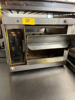 an oven that is sitting on a table in a kitchen