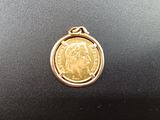 a close up of a coin on a table with a black background