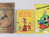 three children ' s books are lined up on a white surface