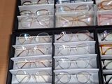 many glasses that are sitting in a drawer on the table