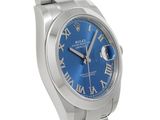 a close up of a wrist watch with blue roman numerals