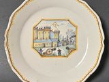 gros plan d'une assiette sur laquelle figure une peinture