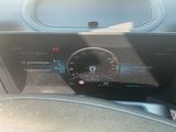 the dashboard of a car with a digital display on it