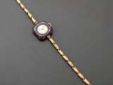 une montre-bracelet en or et émail, avec un cadran bleu