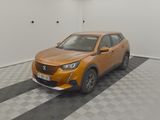 an orange car that is parked in a room