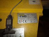 a yellow box with a sign on it that says fmb