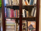 a book case with many books on top of it