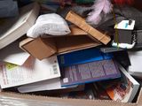 a cardboard box filled with books and other items