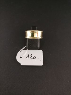 a close up of a small bottle with a tag on it