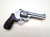 the revolver is sitting on the table ready to be used