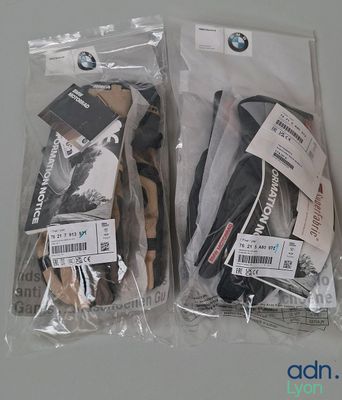 two pairs of shoes that are wrapped in plastic