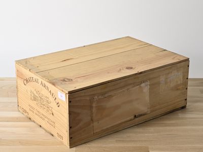 an empty wooden box sitting on top of a hard wood floor