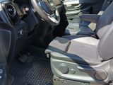 a view of the inside of a vehicle from the driver ' s seat