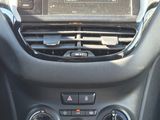 a car dashboard with a radio in it and a steering wheel