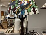 a lamp that is sitting on a table in a room