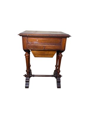an old wooden table with a drawer on top of it