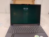 a laptop that is sitting on a table with a box
