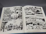 an open book with black and white illustrations on it