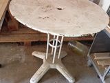 a white table with a wooden top in a room
