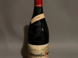 a bottle of wine that is sitting on a table