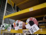 many rolls of tape on a shelf in a store